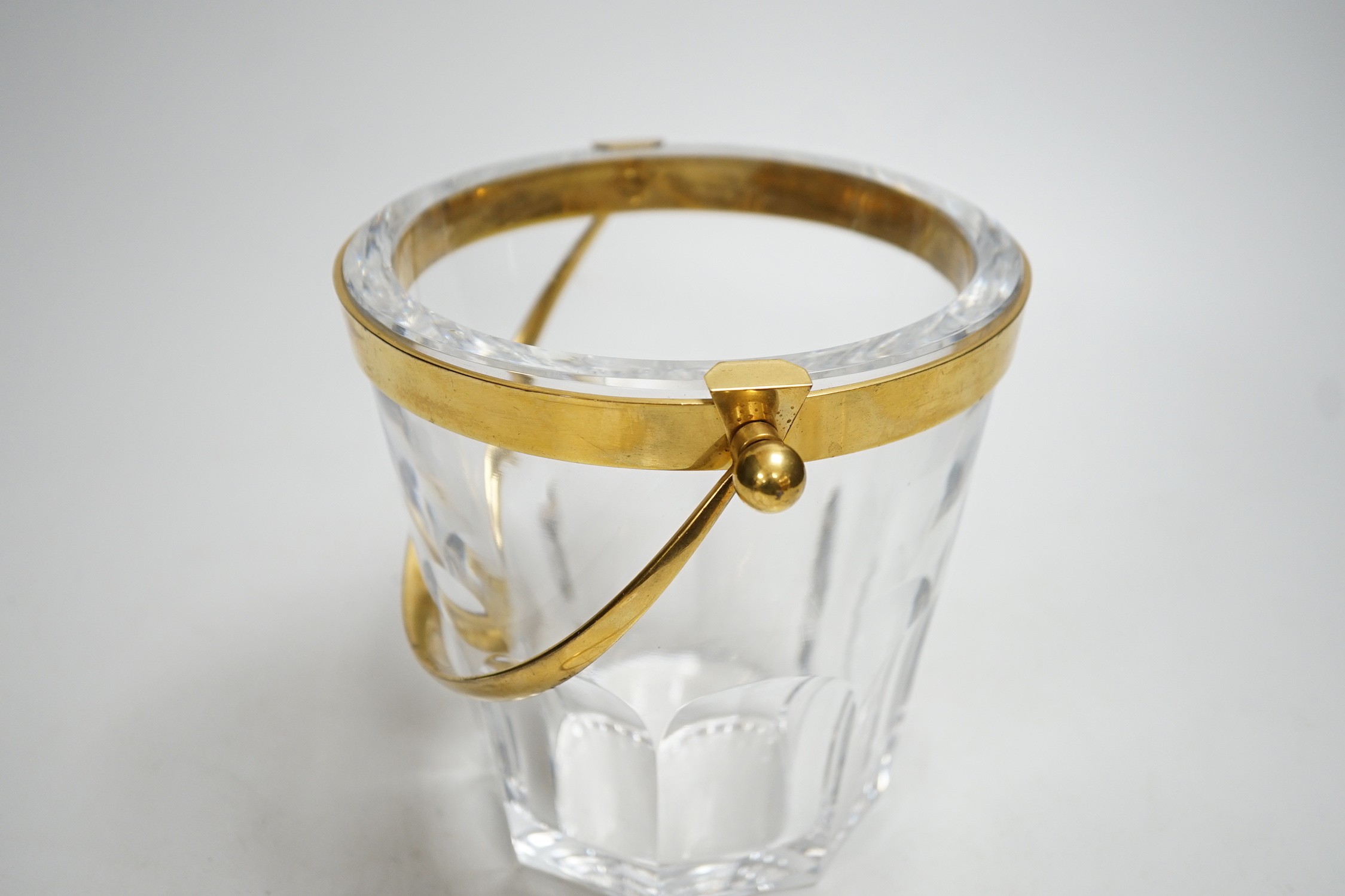 A Baccarat ice bucket, stamped, with gilt mount and matching tong. Bucket 16cm tall